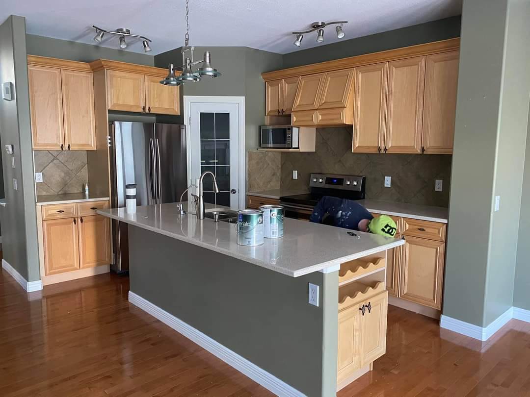 new flooring with freshly painted cabinets